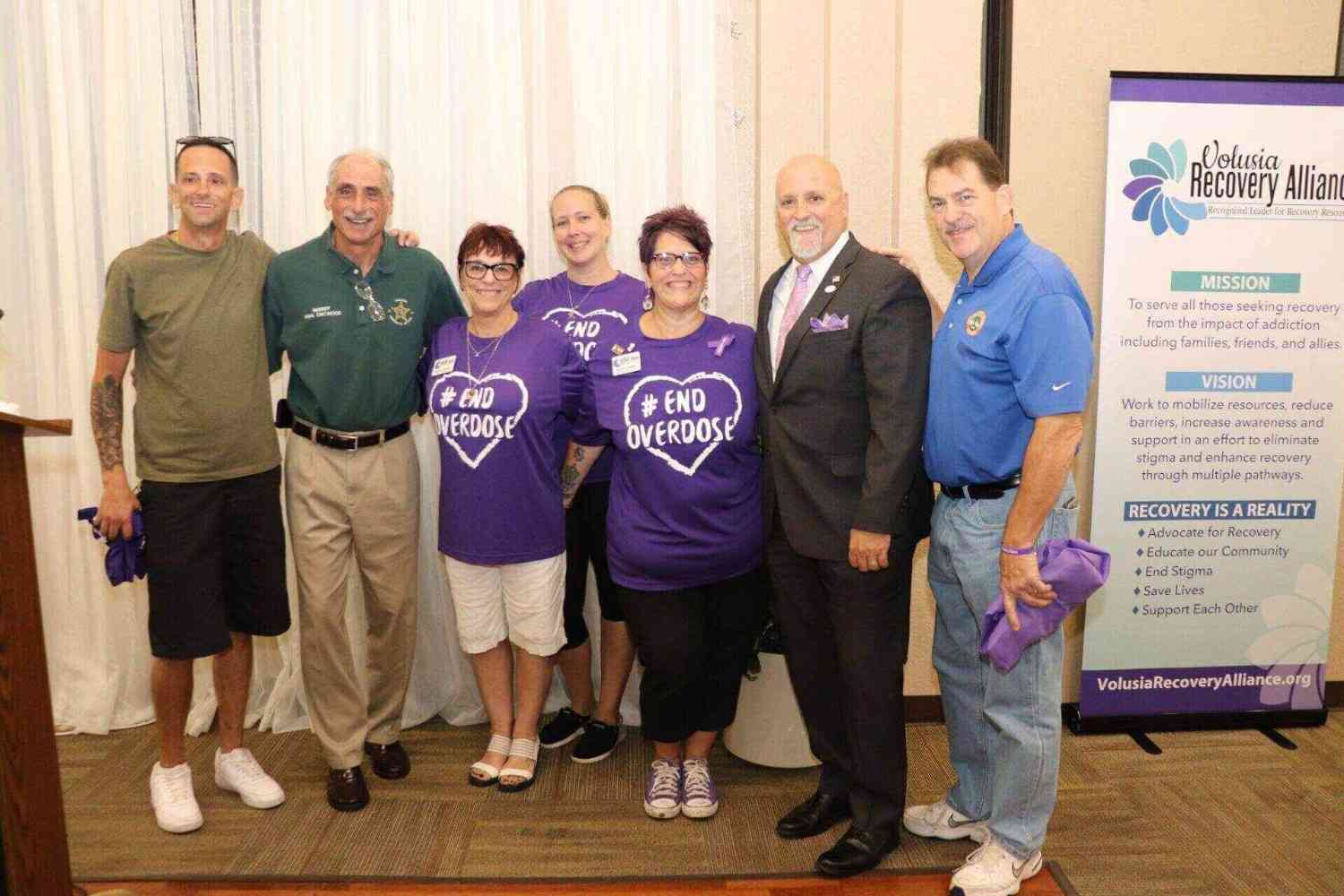 volusia team photo people clicking group photo